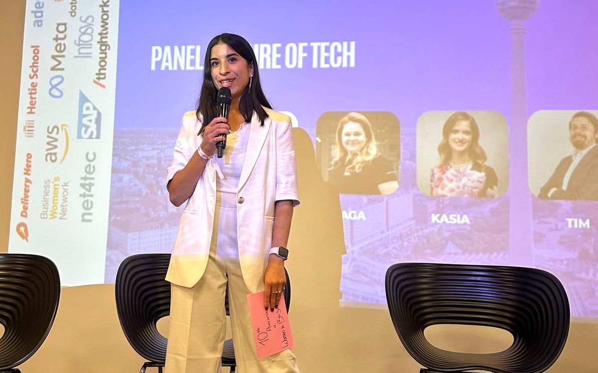 Dilem Kaya delivering a keynote and moderating panels on stage